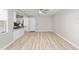 Bright living room featuring neutral paint, laminate flooring, and a ceiling fan at 8681 Sw 93Rd Pl # B, Ocala, FL 34481