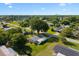 Aerial view of a residential home with lush green lawns, mature trees, and surrounded by a peaceful neighborhood at 8973 Sw 103Rd Ln, Ocala, FL 34481
