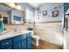 The bathroom is lit by a pair of lights above the mirror at 8973 Sw 103Rd Ln, Ocala, FL 34481