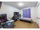 This bedroom features a desk, bookshelf, and a soft mattress at 8973 Sw 103Rd Ln, Ocala, FL 34481
