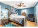 This cozy bedroom features a wooden bed frame and bright blue walls at 8973 Sw 103Rd Ln, Ocala, FL 34481