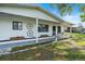 A charming front yard has a sidewalk leading to the front porch at 8973 Sw 103Rd Ln, Ocala, FL 34481