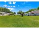 Beautiful backyard with mature trees, providing shade and a peaceful setting at 9330 Sw 84Th Ter # A, Ocala, FL 34481