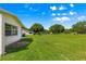 Lush green backyard featuring mature trees offering shade and privacy at 9330 Sw 84Th Ter # A, Ocala, FL 34481