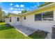 Features a backyard patio and lawn with lush grass at 9330 Sw 84Th Ter # A, Ocala, FL 34481