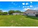 Expansive backyard with lush green grass, perfect for outdoor activities and relaxation at 9330 Sw 84Th Ter # A, Ocala, FL 34481