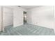 Bedroom features neutral walls, closet, and view into kitchen at 9330 Sw 84Th Ter # A, Ocala, FL 34481