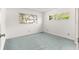 Cozy bedroom featuring neutral walls, and a window with natural light at 9330 Sw 84Th Ter # A, Ocala, FL 34481
