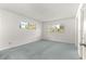 Cozy bedroom featuring neutral walls, and two windows with natural light at 9330 Sw 84Th Ter # A, Ocala, FL 34481