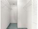 Walk-in closet with metal shelving and blue carpet at 9330 Sw 84Th Ter # A, Ocala, FL 34481