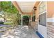 Villa exterior with covered porch and decorative landscaping at 9330 Sw 84Th Ter # A, Ocala, FL 34481