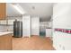 Open kitchen with modern stainless steel refrigerator at 9330 Sw 84Th Ter # A, Ocala, FL 34481