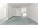 Spacious living room featuring light blue carpet and access to kitchen area at 9330 Sw 84Th Ter # A, Ocala, FL 34481