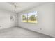 Sun room features neutral carpeting and a ceiling fan at 9330 Sw 84Th Ter # A, Ocala, FL 34481