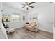 Comfortable bedroom featuring a ceiling fan, neutral colors, and natural light at 9577 Sw 82Nd Street Rd, Ocala, FL 34481