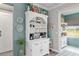 Inviting coffee station with white hutch, decorative accents, and modern coffee makers for convenient mornings at 9577 Sw 82Nd Street Rd, Ocala, FL 34481