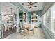 Charming dining area with elegant table and chairs, seamlessly connected to the modern kitchen at 9577 Sw 82Nd Street Rd, Ocala, FL 34481