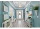 Bright and airy foyer with stylish decor, hardwood floors, and a welcoming ambiance at 9577 Sw 82Nd Street Rd, Ocala, FL 34481