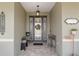 Elegant front door with decorative glass and a welcoming wreath at 9577 Sw 82Nd Street Rd, Ocala, FL 34481