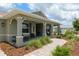 Inviting front porch with comfortable seating and well-manicured landscaping at 9577 Sw 82Nd Street Rd, Ocala, FL 34481