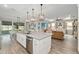 Open kitchen with island, dining area, and living room at 9577 Sw 82Nd Street Rd, Ocala, FL 34481