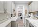 Well-appointed laundry room with ample storage and modern washer and dryer at 9577 Sw 82Nd Street Rd, Ocala, FL 34481