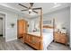 Comfortable main bedroom with hardwood floors, a ceiling fan and decorative wooden furniture at 9577 Sw 82Nd Street Rd, Ocala, FL 34481