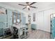 Comfortable office space with luxury vinyl floors, a custom built-in desk, and coastal-themed decor at 9577 Sw 82Nd Street Rd, Ocala, FL 34481