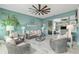 Relaxing sunroom with stylish wicker furniture, ceiling fan, and seamless transition to indoor living at 9577 Sw 82Nd Street Rd, Ocala, FL 34481