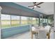 Relaxing sunroom with large windows offering golf course views and plenty of natural light at 9577 Sw 82Nd Street Rd, Ocala, FL 34481
