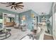 Bright sunroom seamlessly connecting to the outdoors and adjacent dining and living spaces at 9577 Sw 82Nd Street Rd, Ocala, FL 34481