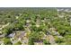 An aerial view of a quiet neighborhood with a mix of homes, shaded by mature trees and well-kept streets at 1014 Ne 12Th St, Ocala, FL 34470