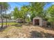 Exterior photo displaying the home's backyard with storage sheds at 1014 Ne 12Th St, Ocala, FL 34470