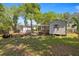 Exterior photo displaying the home's backyard with storage sheds at 1014 Ne 12Th St, Ocala, FL 34470