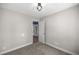 Neutral bedroom with carpet, white trim, and open doorway at 1014 Ne 12Th St, Ocala, FL 34470