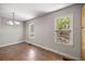 Bright dining area with wood-look floors and views to the outside from two windows at 1014 Ne 12Th St, Ocala, FL 34470