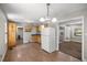Open kitchen with tile floors and access to other rooms at 1014 Ne 12Th St, Ocala, FL 34470