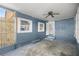 Covered back patio with ceiling fan, offering a space for outdoor relaxation at 1014 Ne 12Th St, Ocala, FL 34470