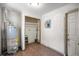 Utility room features a water heater, closet and a tile floor at 1014 Ne 12Th St, Ocala, FL 34470