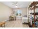 This bedroom can be used as a home office with a desk, shelving, and daybed at 10451 Sw 98Th Place Rd, Ocala, FL 34481