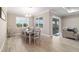 Bright dining room with large windows and neutral decor, perfect for Gathering meals and gatherings at 10451 Sw 98Th Place Rd, Ocala, FL 34481