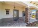 Beautiful front porch featuring a charming entrance with decorative stone pillars at 10451 Sw 98Th Place Rd, Ocala, FL 34481