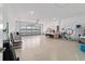 Spacious garage with white walls, a roll-up door, and ample space at 10451 Sw 98Th Place Rd, Ocala, FL 34481