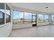 A cozy lanai with screened windows and a view of the community at 10451 Sw 98Th Place Rd, Ocala, FL 34481