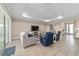 Comfortable living room with a tv, couches, and access to other rooms in the house at 10451 Sw 98Th Place Rd, Ocala, FL 34481