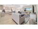 Spacious open floor plan seamlessly connects kitchen and living area, perfect for entertaining at 10451 Sw 98Th Place Rd, Ocala, FL 34481