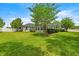 The house shows a sprawling green lawn and a screened-in patio, perfect for outdoor enjoyment at 1107 Se 49Th Ave, Ocala, FL 34471