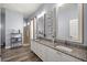 Dual vanity bathroom with granite counters and standing shower at 1107 Se 49Th Ave, Ocala, FL 34471