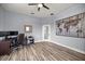 Light and bright bedroom with wood-look flooring and modern, unique wall art at 1107 Se 49Th Ave, Ocala, FL 34471