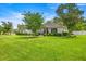 Charming home with well-manicured lawn, stone accents, and lush landscaping creates great curb appeal at 1107 Se 49Th Ave, Ocala, FL 34471